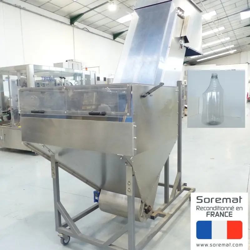 trémie avec élévateur à taquet pour les flacons